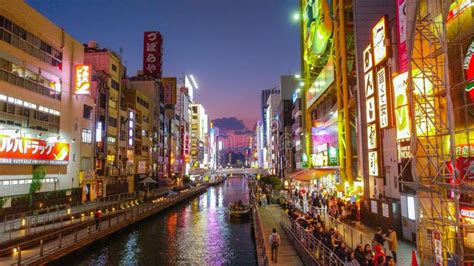 Dotonbori Canal with Illuminated Buildings at Sunset Near the Shopping ...