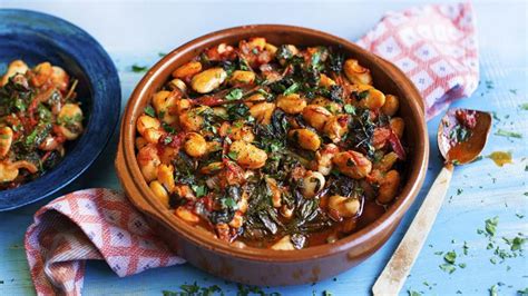 Gigantes with tomatoes and greens recipe - BBC Food