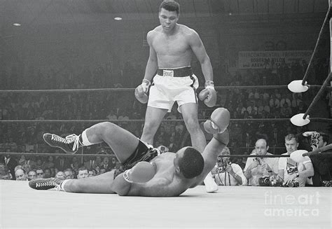 Cassius Clay And Sonny Liston by Bettmann