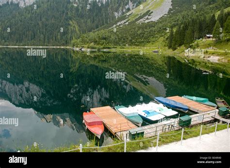 Austria Upper Austria Gosau Lake Gosau in the Dachstein Mountains boats docked to a wharf Stock ...