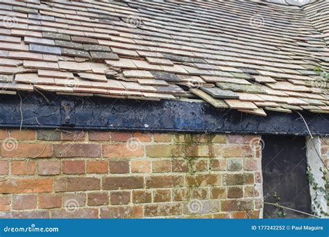 Damaged Clay Roof Tiles on a Pitched Roof, UK Stock Photo - Image of damaged, neglected: 177242252