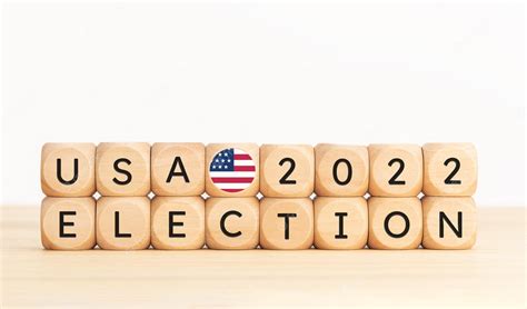 Premium Photo | Usa 2022 presidential election concept wooden block with text and american flag ...