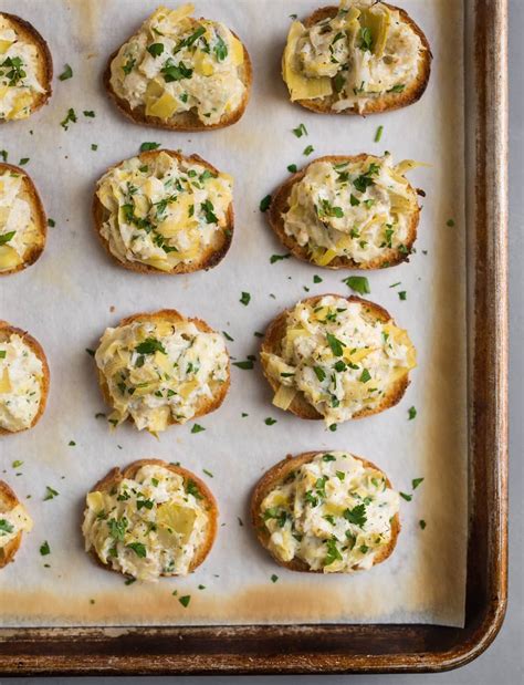 Easy crab appetizers are great for holiday parties, and these Crab Artichoke Toasts are ...