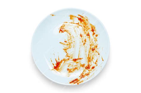 Premium Photo | A dirty plate with leftover sauce Isolated on a white background