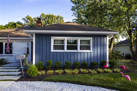 What a beautiful Florida home. The regatta blue siding makes the white windows and accent wall ...