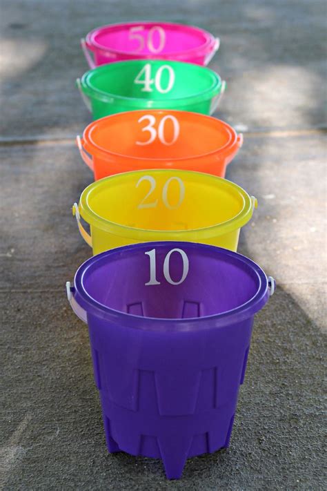 Bucket Ball Toss – you will need 5 buckets, 3 soft balls, and sticky numbers. I used my vinyl ...