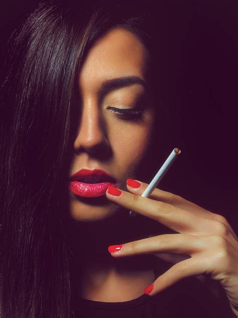 Portrait of the beautiful elegant girl smoking cigarette on black background. Pastel by Ivan ...