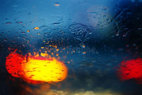 Rain Drops on Car Glass with Traffic Light , Focus on Raindrops Stock ...