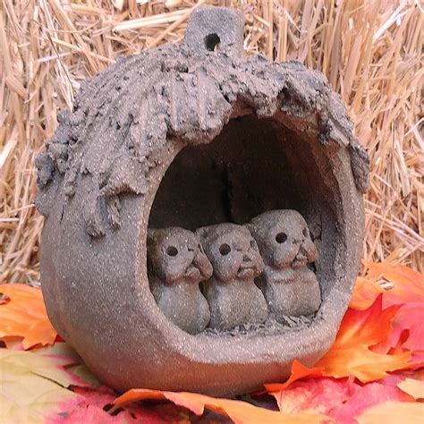 Pugs in a Pumpkin - Margaret Hudson's Earth Arts Studio