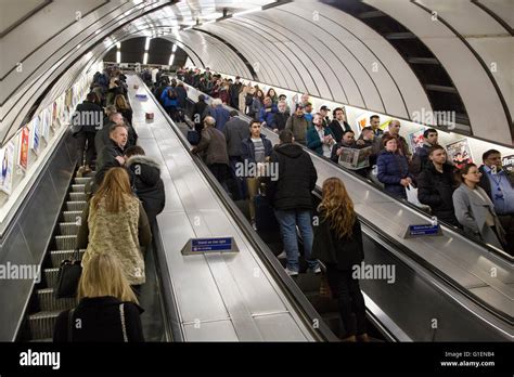 Commuters traveling up the escalators at Holborn tube station, London ...