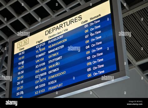 Flight departure information board at airport Stock Photo - Alamy