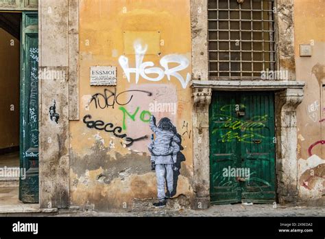 Street art on a wall in the Trastevere district of Rome,Italy Stock Photo - Alamy