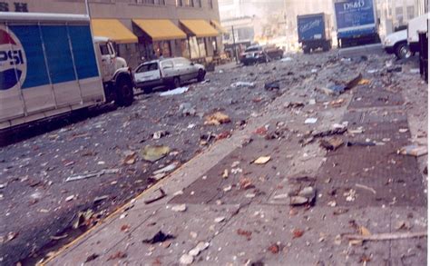 the street is littered with garbage and trash as trucks are parked in ...