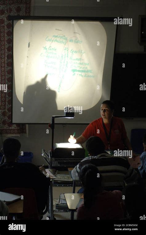 Austin, TX September 22, 2006: Female teacher uses overhead projector ...