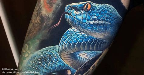 Healed blue viper snake tattoo.