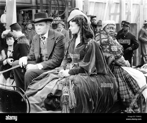 CARROLL NYE as Frank Kennedy VIVIEN LEIGH as Scarlett O'Hara HATTIE McDANIEL as Mammy GONE WITH ...