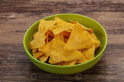 Mexican crunchy corn nachos triangle 8435077 Stock Photo at Vecteezy