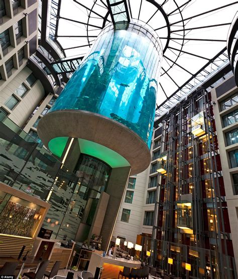 The incredible 82ft-tall hotel aquarium in Berlin that has an elevator for guests inside it ...