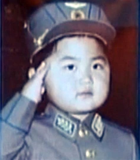 Kim Jong Un seen saluting in military uniform as a young boy in family ...