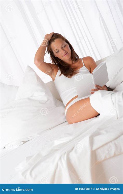 Young Woman Reading Book in Bed Stock Image - Image of adult, female ...