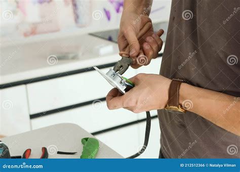 Installing an Electrical Outlet on a Kitchen Countertop Stock Photo - Image of building, manual ...