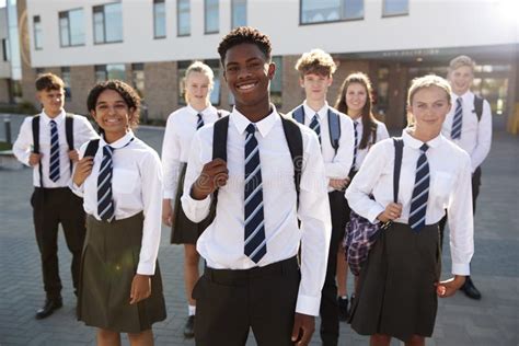 Portrait of Male Secondary or High School Student Outdoors at School with Mobile Phone Stock ...