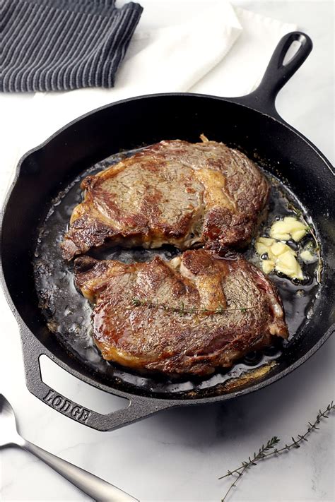 Pan-Seared Ribeye with Garlic Butter makes a perfect home-cooked meal for two. Ribeye steaks a ...