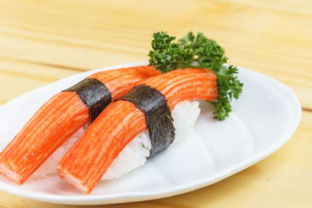 Traditional japanese food, Immitation Crab Sticks or Kani Kamaboko sushi on wooden tableの写真素材 ...