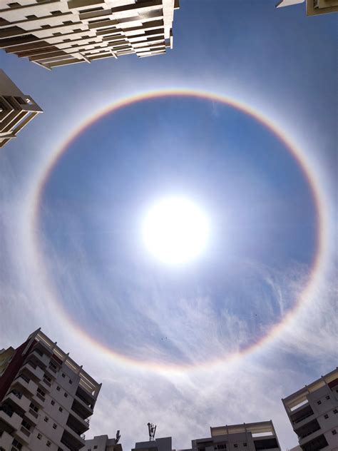 Skywatchers Witness Breathtaking Rainbow Halo Around the Sun Over City in Southern India