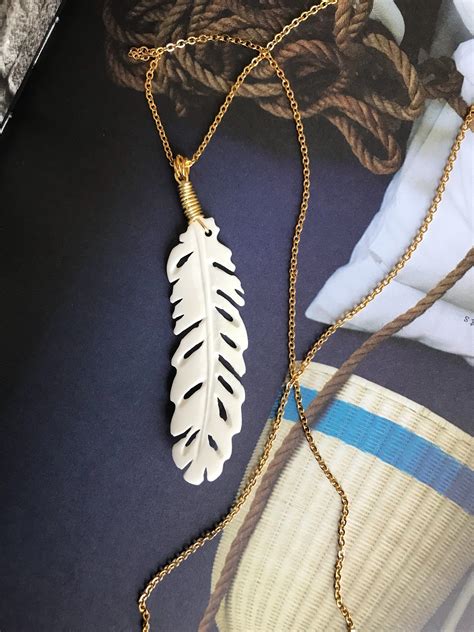 Excited to share the latest addition to my #etsy shop: Bone feather pendant necklace,Gold chain ...