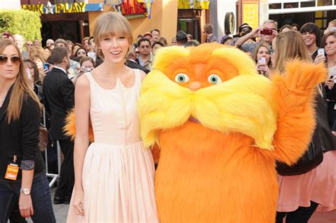 Taylor Swift Gets Cozy With ‘The Lorax’ Co-Stars at Hollywood Premiere