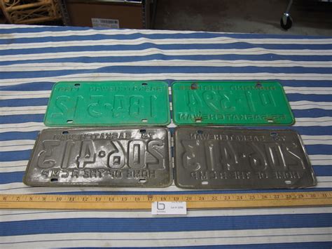 4 Vintage License Plates