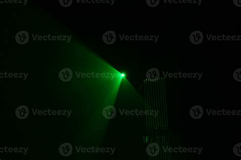 green beam laser beam on dark background 20465706 Stock Photo at Vecteezy