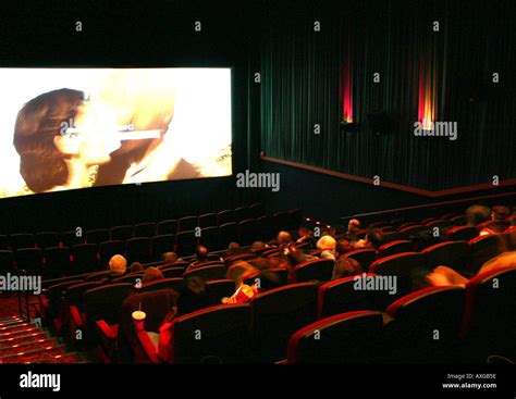 Movie theater audience watching previews Stock Photo - Alamy