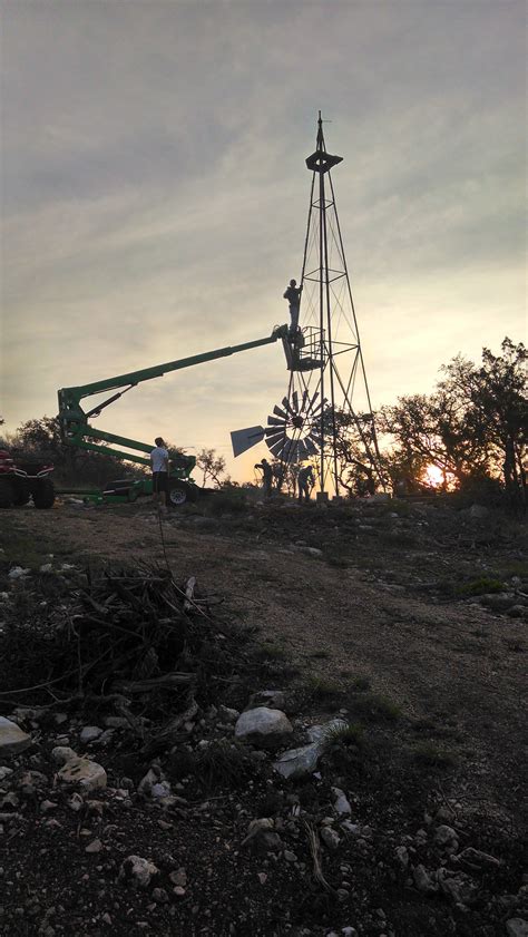 Raising a windmill at sunrise. : pics