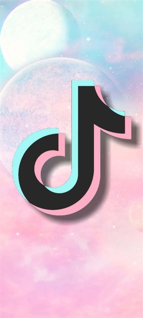 Download A Pink And Blue Tiktok Logo On A Pink Background Wallpaper | Wallpapers.com