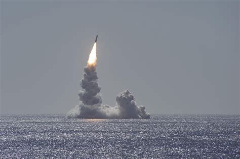 An unarmed Trident II (D5LE) missile launches from the Ohio-class ...