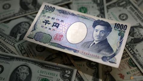 Dollar hurt by 'dovish' Powell; yen up on BOJ policy shift speculation ...