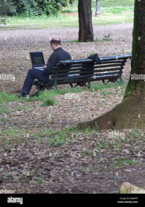 man working on laptop outdoors Stock Photo - Alamy