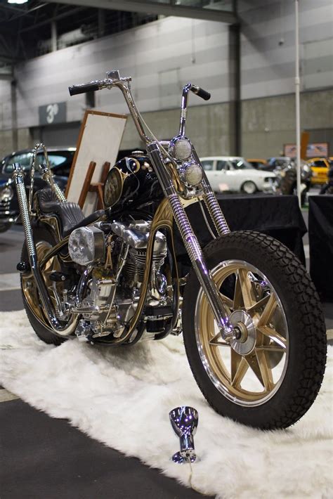 a motorcycle is on display at a car show