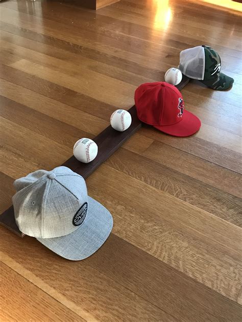 This baseball hat rack is the perfect hat rack for any baseball player ...