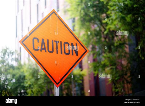 Pedestrian crossing sign under construction with orange color Stock Photo - Alamy