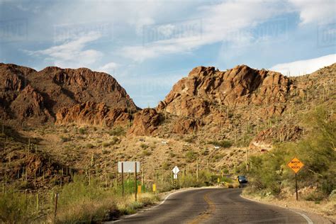 USA, Arizona, Gates Pass, Gates Pass Road through Tucson Mountains. - Stock Photo - Dissolve