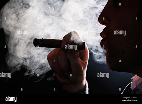 Cigar smoke hi-res stock photography and images - Alamy