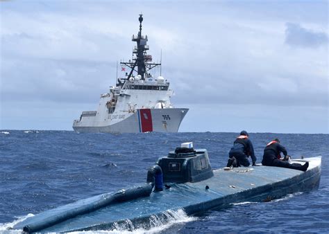 Watch a Coast Guardsman leap onto a moving submarine in the Pacific