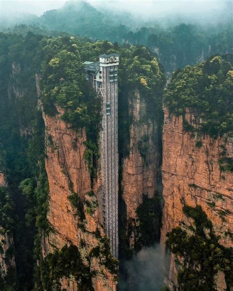 Located in Zhangjiajie City, China, the Zhangjiajie National Forest Park's towering Bailong ...