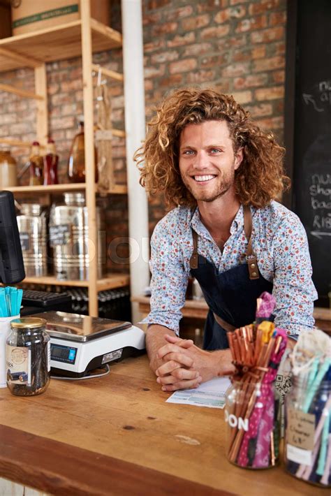 Portrait Of Male Owner Of Sustainable Plastic Free Grocery Store Behind ...