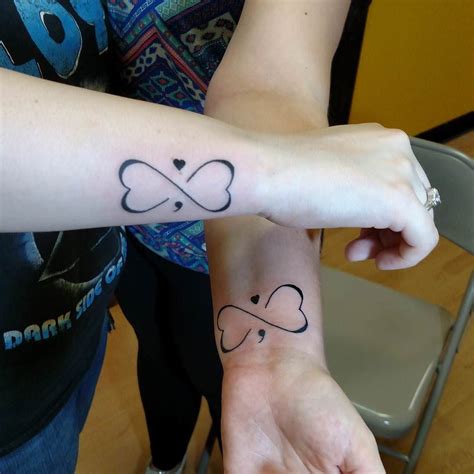 Love Symbol Tattoo Design semicolon | Tattoos for lovers, Love symbol tattoos, Cute tattoos on wrist