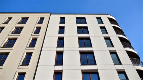 Premium Photo | A building with a blue sky and a few windows