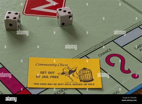 Monopoly board showing Get Out of Jail Free card along with dice Stock ...